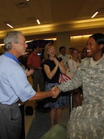 Bush greets woman soldier