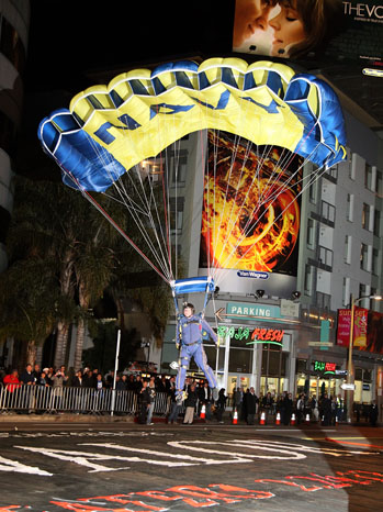 HOLLYWOOD, CA - FEBRUARY 13:  U.S. Navy Parachute Team/Leap Frogs member parachutes onto Sunset Blvd at the premiere of Relativity Media's "Act of Valor" at ArcLight Cinemas on February 13, 2012 in Hollywood, California.  (Photo by David Livingston/Getty Images)